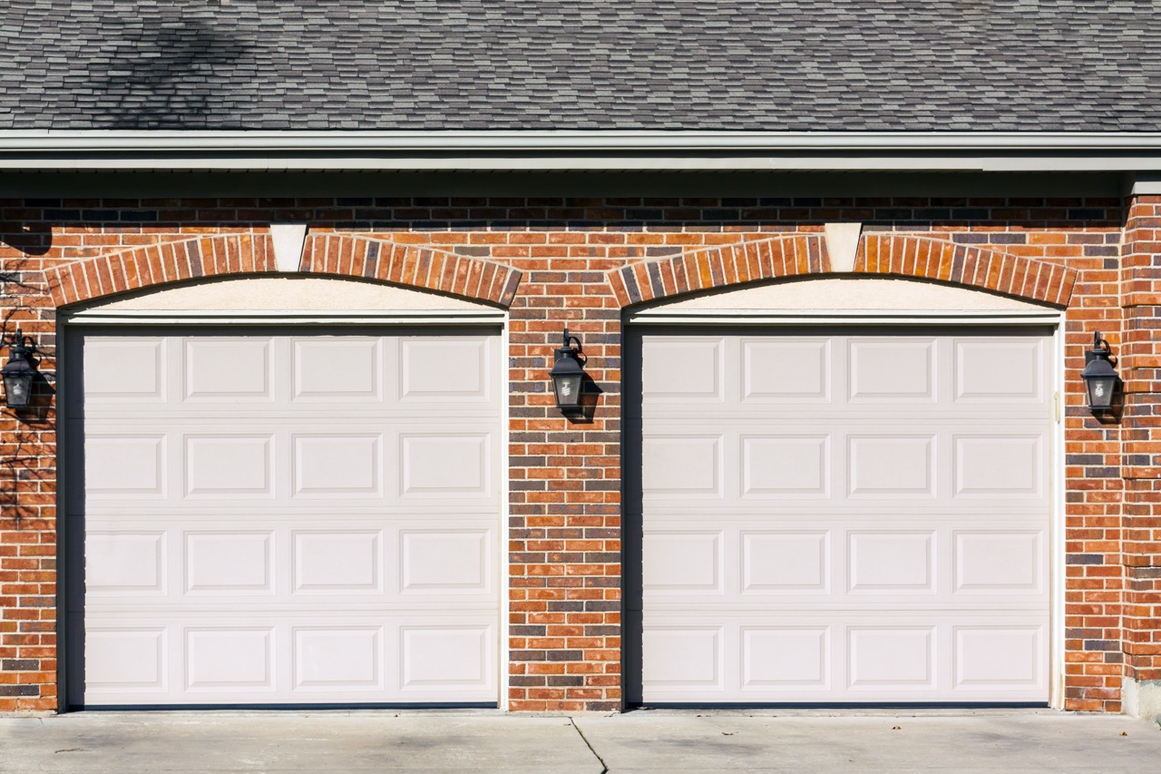 Garage Exterior with Brickwork and Shingled Roof