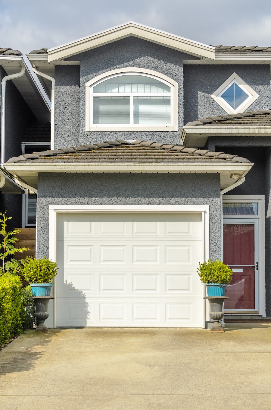 A view of the exterior of a gray suburban house