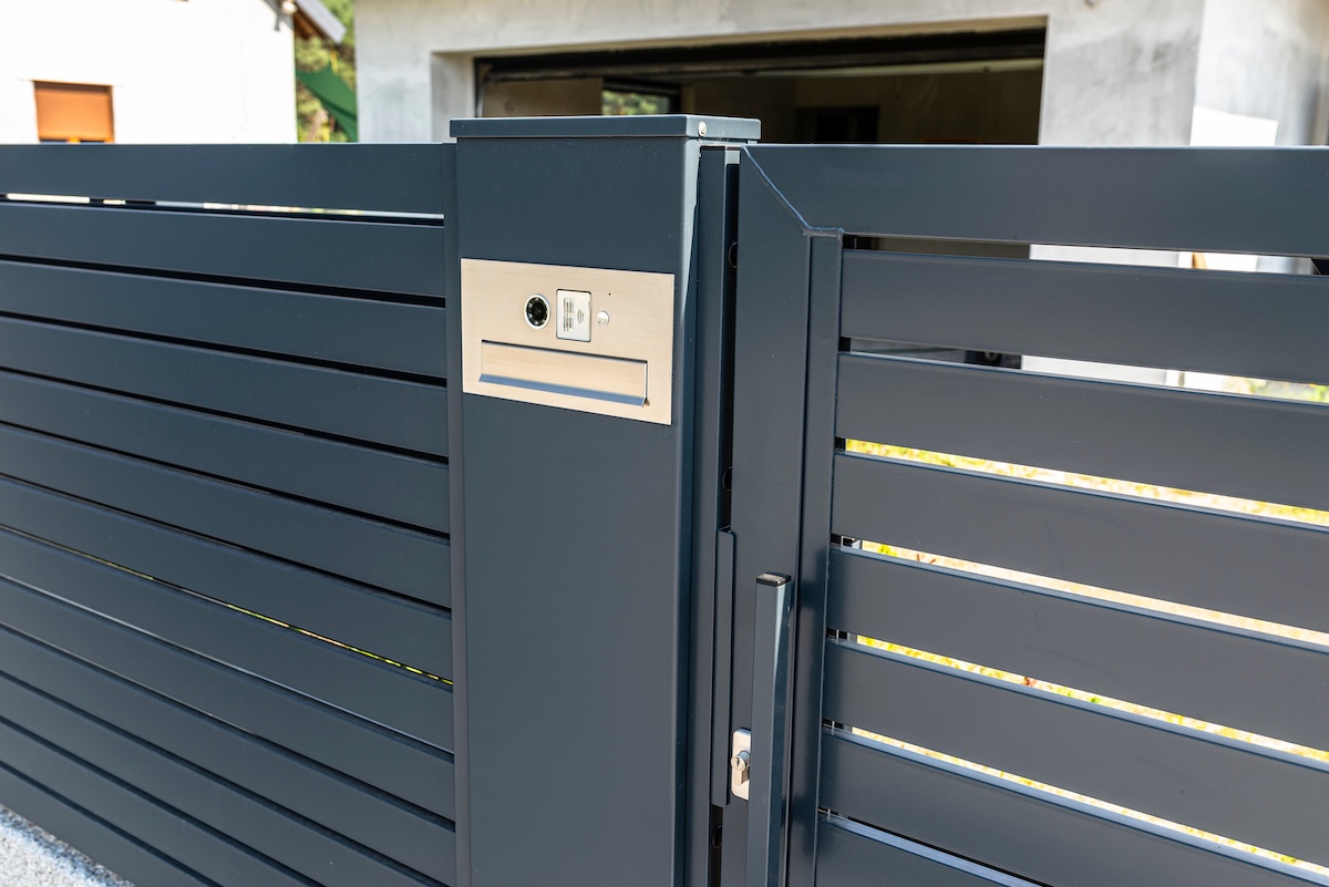 Modern Gray Metal Fence with Gate and Mailbox