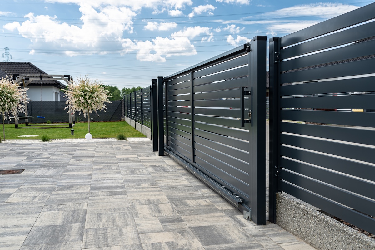 Modern Metal Fence and Yard in Suburban Setting