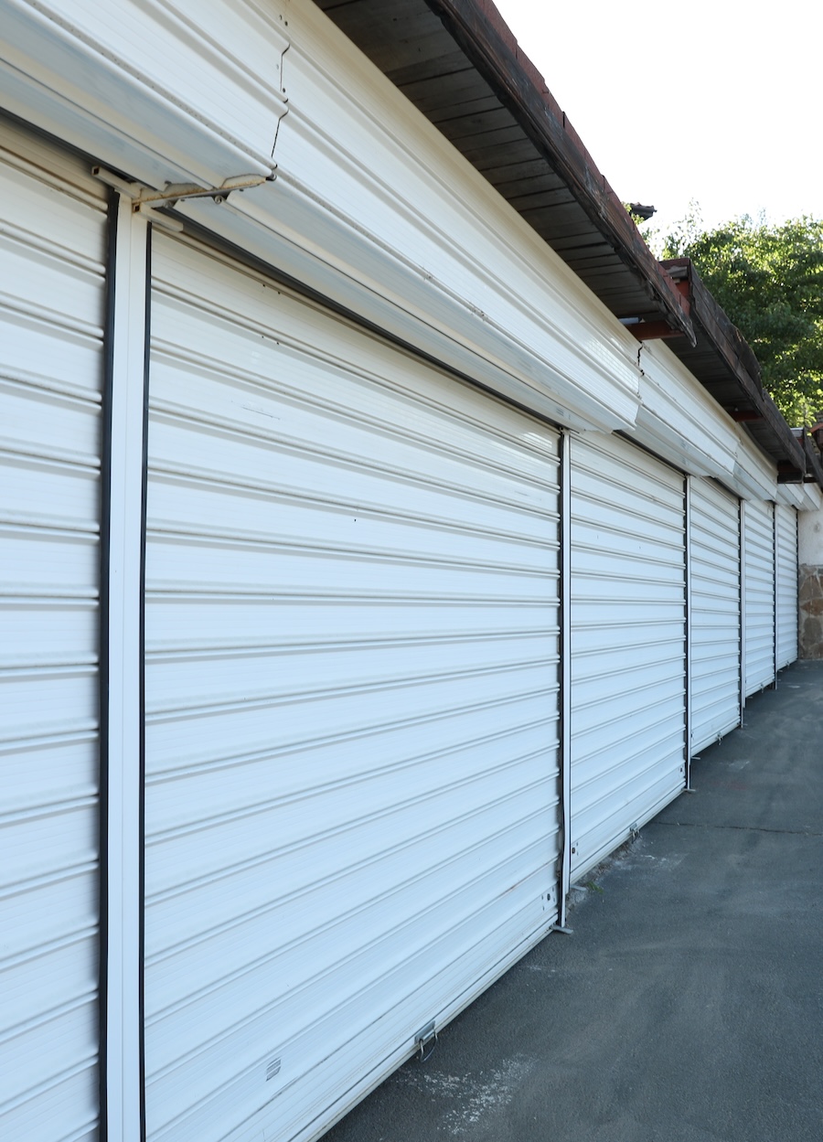 Row of White Metal Roller Shutters